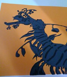 an image of a scorpion on a piece of paper that has been cut in half