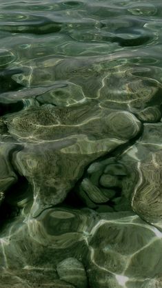 the water is crystal clear and has ripples on it's surface, as seen from above