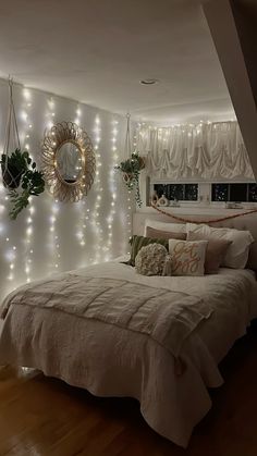 a bedroom with lights on the wall and a bed in it's center area