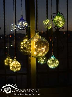 some lights hanging from the side of a window