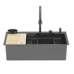 a sink that has some sort of utensils in the bottom drawer and is made out of wood