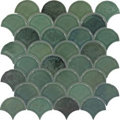 a green and black mosaic tile with wavy shapes