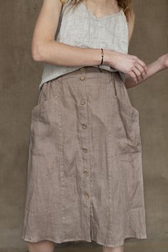 "Welcome to Pavietra! This linen skirt is handmade to order in your choice of 20 gorgeous colors. Made of organic linen, it features a midi length, patch pockets, and a front button fastening. This classic skirt can easily go from season to season, and it a wardrobe stable you will wear year after year. SKIRT DETAILS ⚬ Front button fastening ⚬ Elastic waistband. ⚬ Patch pockets. ⚬ Midi length skirt at 27\" long (68 cm). If you would like to add or subtract 10cm from the length, just let us know. Linen Skirt Midi, Midi Skirt With Pockets, Classic Skirts, Skirt Midi, Midi Length Skirts, Skirt With Pockets, Linen Skirt, Linen Blouse, Organic Linens