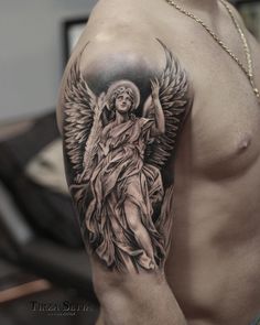 a man's arm with an angel tattoo on the left side of his body