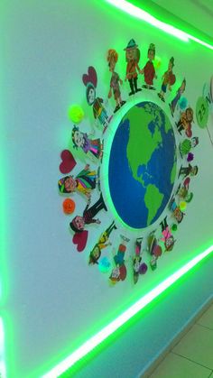 there is a green light on the wall with many stickers all over it,