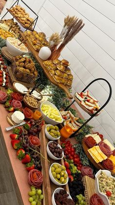 a buffet table filled with lots of different types of foods and desserts on it