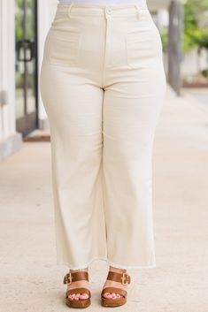 Get ready to tackle your day in style with our Girl On The Go Jeans in white! These jeans feature trendy front pockets and a frayed hemline, making them perfect for dressing up or down! Add a versatile and chic staple to your wardrobe with these must-have jeans! 97% Cotton, 3% Spandex Cream Cropped Leg Cotton Pants, Chic White Pants With Frayed Hem, Chic Pants With Frayed Hem For Workwear, Chic Workwear Pants With Frayed Hem, Off White Cotton Pants For Work, Everyday Cotton Bottoms With Frayed Hem, Cotton Bottoms With Frayed Hem For Everyday, Cotton Cropped Leg Pants For Day Out, Spring Cotton Pants With Frayed Hem