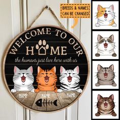 a wooden sign that says welcome to our home with four cats on it and the words,