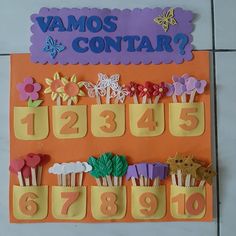 a bulletin board with cupcakes and flowers on it that says vamos contar?