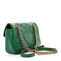 This is an authentic GUCCI Calfskin Matelasse Mini GG Marmont Shoulder Bag in Emerald Green. This shoulder bag is crafted of smooth and supple calfskin leather in green. This bag features an aged gold chain and leather shoulder strap. The front flap features an interlocking GG logo and opens to a beige suede interior with a zipper pocket. Gg Logo, Gg Marmont, Light Beige, Emerald Green, Gold Chain, Patch Pocket, Gold Chains, Zipper Pocket, Calf Skin