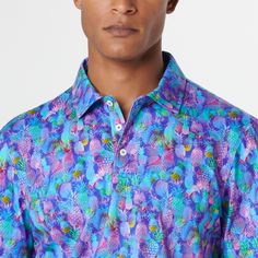 The Victor short-sleeved polo shirt features a novelty pineapple print on OoohCotton fabric, a three button placket, genuine shell buttons and a self fabric collar. OoohCotton is a double-mercerized, wrinkle-resistant, breathable, and easy-care cotton blend with stretch, quick-dry, and thermal comfort properties. Blue Polo Shirt With Spread Collar, Blue Polo Shirt With Button Closure And Spread Collar, Blue Johnny Collar Polo Shirt For Summer, Blue Polo Shirt With Collar And Buttons, Summer Golf Shirt With Polo Collar, Blue Fitted Polo Shirt With Spread Collar, Fitted Polo Shirt With Spread Collar For Summer, Blue Summer Golf Shirt, Blue Golf Shirt For Summer