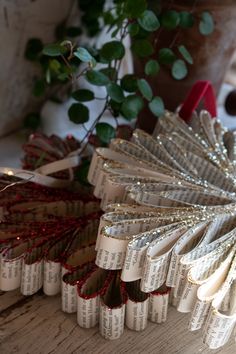 several decorative paper fans sitting on top of a wooden table