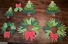 handprinted christmas wreaths made out of paper with bows and stars on them