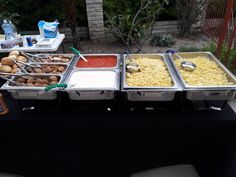 a buffet table filled with different types of food and drinks on it's sides