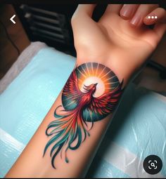 a woman's arm with a colorful tattoo on it