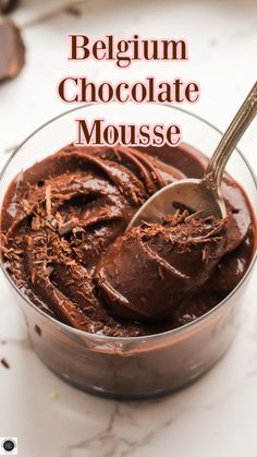 a bowl filled with chocolate mousse on top of a table