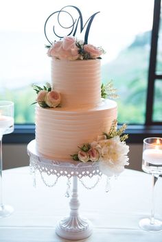 a wedding cake sitting on top of a table