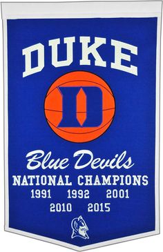 the duke blue devils national champs banner is hanging from a white frame with an orange and blue basketball on it