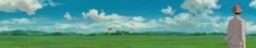 a man standing in the middle of a lush green field under a blue cloudy sky