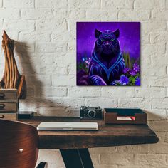 a black cat sitting on top of a wooden desk next to a white brick wall