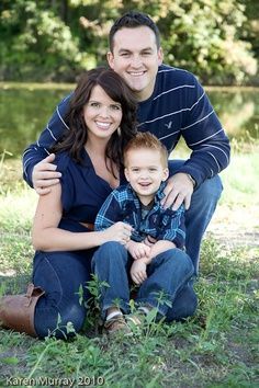 a man and woman pose for a photo with their son