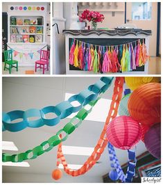 there are many different colored paper decorations in this room, and one is hanging from the ceiling