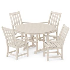 a white table and four chairs sitting next to each other