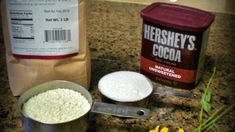 ingredients to make homemade marshmallows sitting on a granite counter top next to a measuring cup