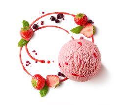 a scoop of ice cream with strawberries and raspberries around it on a white background