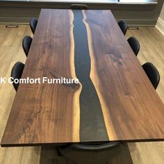 a wooden table with black leather chairs around it