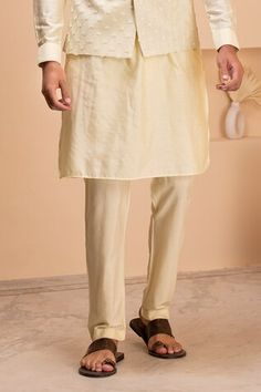 Lemon yellow sleeveless bundi with all over Gulshan bloom embroidery. Paired with a full sleeves kurta and an Aligadhi pant. - Aza Fashions Spring Fitted Dabka Sherwani, Traditional Spring Nehru Jacket With Dabka, Traditional Sherwani With Pallu For Spring, Yellow Nehru Jacket For Festive Spring Occasions, Yellow Nehru Jacket For Spring Festivals, Festive Yellow Nehru Jacket For Spring, Yellow Fitted Nehru Jacket For Diwali, Fitted Yellow Nehru Jacket For Diwali, Traditional Wear With Naqshi For Festive Spring Season