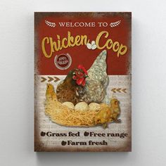 a chicken coop sign hanging on the side of a wall with hay and eggs in it