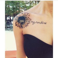 a woman with a sunflower tattoo on her arm that says you are my sunshine