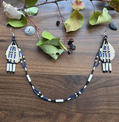 These jewelry sets are inspired by my very own culture🖤 Yup'ik Alaska Inuit agluirutet, a 2-in-1 Inuit style attached necklace+earrings set. This set can be worn with or without the chin decoration! Hung from silver toned hypoallergenic hooks, this is made with caribou antler slices that my Apa (grandfather) had at fishcamp, family treasures. With antique bone tube beads and blue, black and antique white beadwork Traditional Polished Beads Jewelry For Crafting, Traditional Dangle Black Bead Jewelry, Traditional Hand-strung Dangle Jewelry, Artisan Black Beads Dangle Jewelry, Artisan Black Bead Dangle Jewelry, Artisan Black Beaded Dangle Jewelry, Traditional Black Beads Jewelry For Crafting, Traditional Black Beaded Jewelry For Crafting, Southwestern Style Black Beads Jewelry For Gift