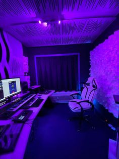 a room with purple lighting and sound equipment