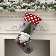 a christmas stocking hanging from a mantel