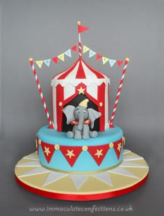 a circus cake with an elephant on top