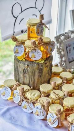 a table topped with lots of cookies covered in honey