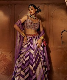 Make a style statement like a traditional diva in this alluring lehenga set featuring a geometrical print skirt with a multi-colour embroidered border and an intricately embroidered blouse styled with a coordinated dupatta. Embroidered Border, Print Skirt, A Style, Style Statement, Raw Silk, Embroidered Blouse, Blouse And Skirt, Blouse Styles, Printed Skirts