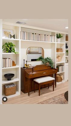 a living room with bookshelves and a piano in the corner, along with other furniture