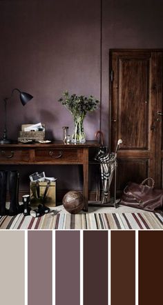 a living room with purple walls and furniture