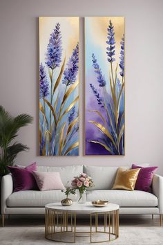 two paintings on the wall above a couch in a living room with purple and gold accents