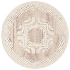 a round rug with an abstract design on the center and bottom, in light beige