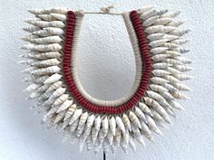 A heavyweight men necklace / tribal necklace of Irian Asmat, decorated with lovely shells/seashells on a macrame of cotton strings background. Excellent condition, new collection. Stand included. Would go well for beach wedding / home / office / boutique store or simply as gift for your loved ones. The Asmat have one of the most well-known wood carving traditions in the Pacific, and their art is sought by collectors worldwide. men Necklace Height(with stand): 44 cm / 17.3 inches Necklace only(H Hawaii Necklace, Cotton String, Body Adornment, Boutique Stores, Seashell Jewelry, Tattoo Shop, Brass Earrings, Men Necklace, Body Jewelry