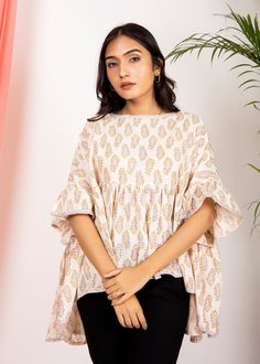 Introducing our Jiya Blouse - your chic and comfy go-to for hot sunny days. Stay cool with its 100% Hand-block printed lightweight cotton fabric and stay stylish effortlessly. Perfect for the beach, brunch, or any casual outing. Elevate your summer wardrobe with comfort and flair. Sizes Available Product details -Fabric: 100% hand block printed cotton -Made In India Return Policy- There are many chances where sizing issues occur and we do take exchange of the Products but many a times we encount Cotton Short Tops, Beach Brunch, Torn Clothes, Cotton Tunic Tops, Cotton Tunic, Beige Top, Mini Robes, Top For Women, Printed Midi Dress