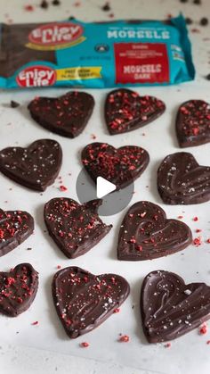 heart shaped chocolates with sprinkles on a table