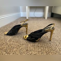 Raye Heels. Size 8.5. Never Worn. Shiny Gold & Black Satin. Black Glamorous Heels For Work, Glamorous Black Heels For Work, Chic Black Heels For Dinner, Black Glamorous Heels, Chic 4-inch Heels For Dinner, Black Heels With 4-inch Heel For Dinner, Black Heels With Wrapped Heel For Dinner, Satin Color, Black Satin