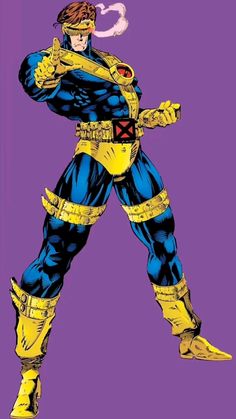 a man in blue and yellow is standing with his hands on his hips while wearing an armor