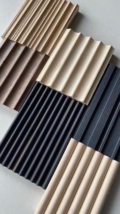 several different types of wooden slats on a white surface with black and brown lines