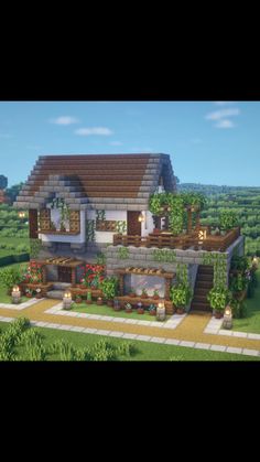 a very nice looking house in the middle of some green grass and flowers on it